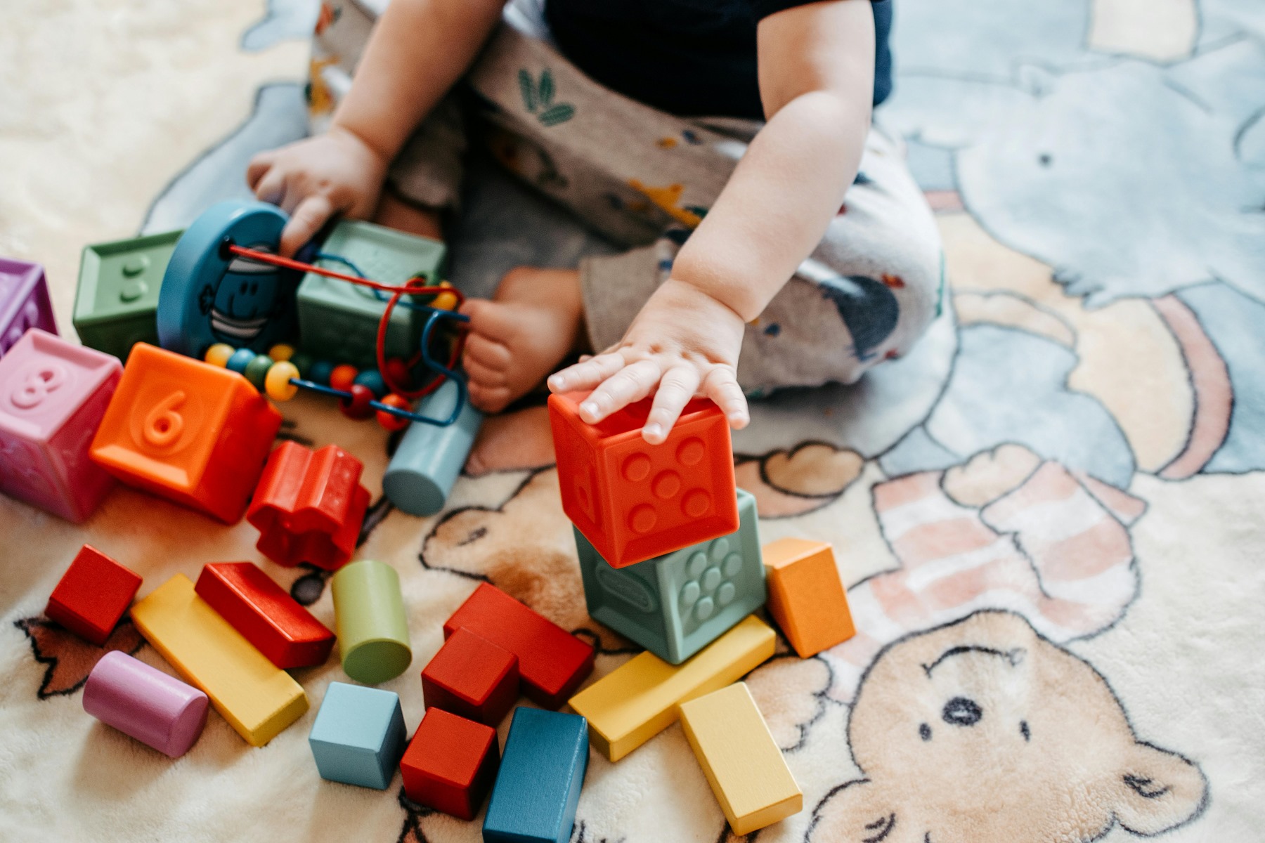 A toddler is playing with toys