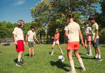 A group of children are playing football